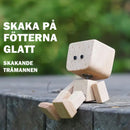 Charmig liten gungfigur i trä med 12 magnetiska uttryck