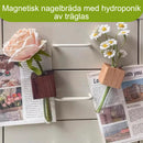 Flytande väggmonterad rörformad vas