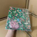 Roligt julklappspapper med mönstrade siffror