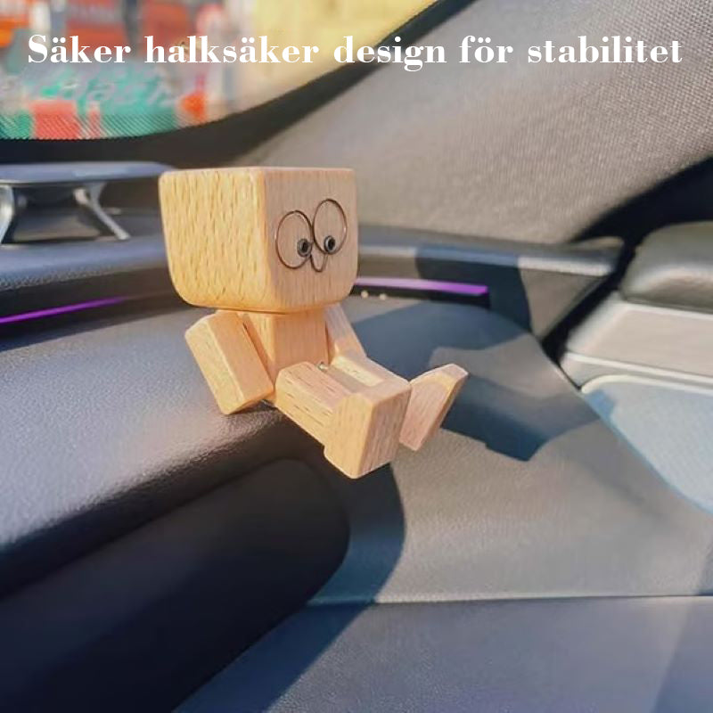 Charmig liten gungfigur i trä med 12 magnetiska uttryck