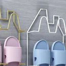 Väggmonterad självhäftande toffelhållare