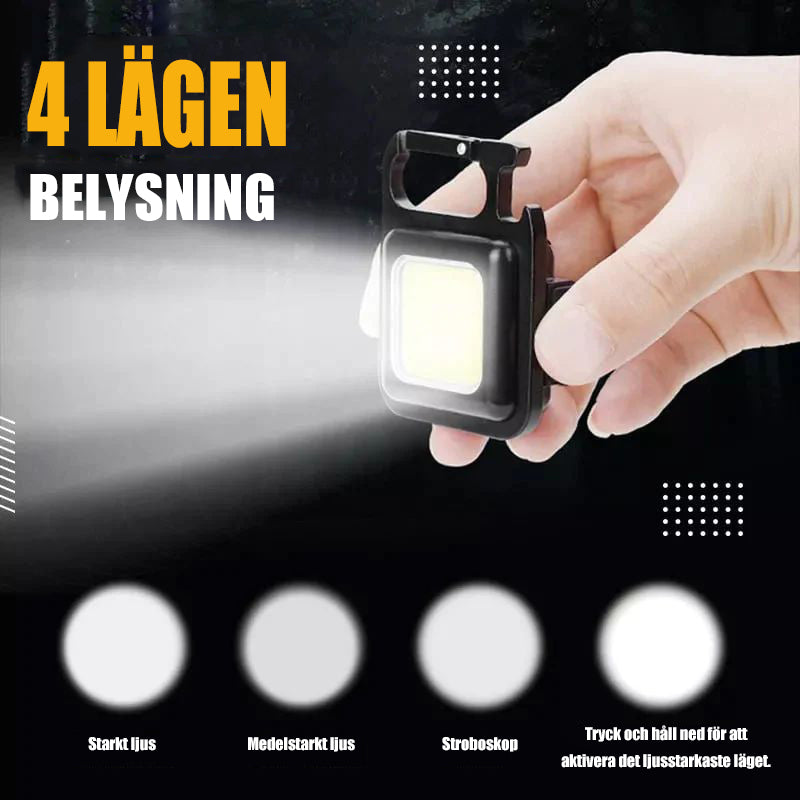 Multifunktionell nyckelring Nödlampa
